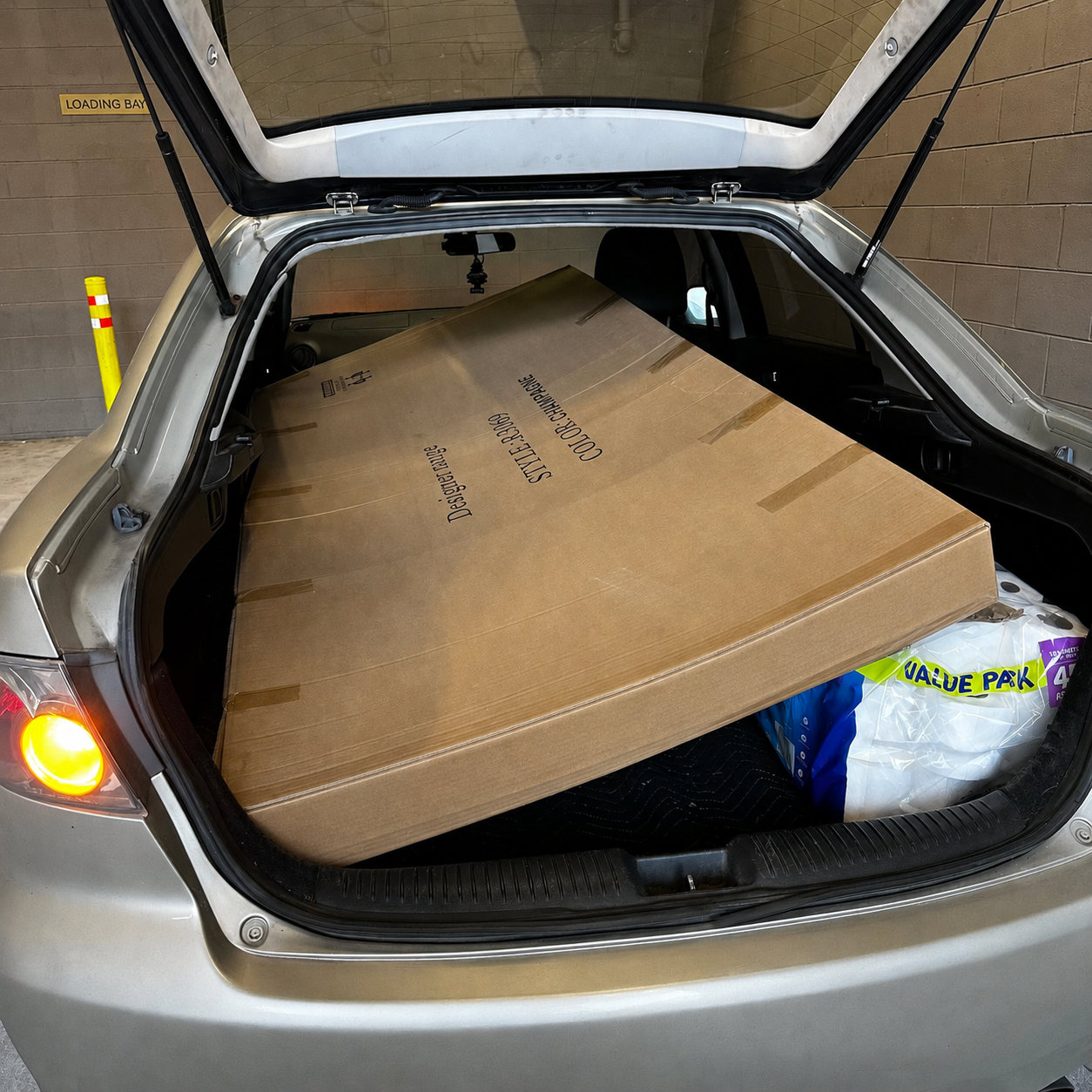 A two metre by one metre boxed item loaded inside The Limousine